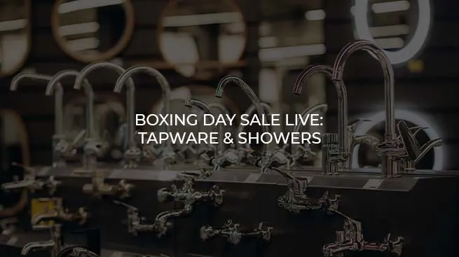 Modern chrome bathroom taps and shower heads on display for a Boxing Day sale